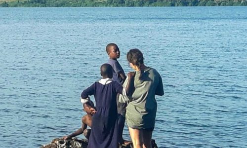 Charlotte Wager with children at Firefly Uganda
