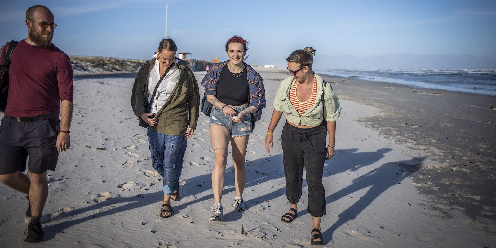 Interns having a walk in the beach