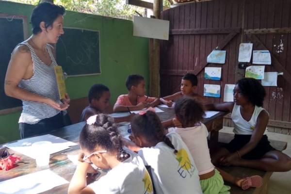volunteer teaching local kids indoor
