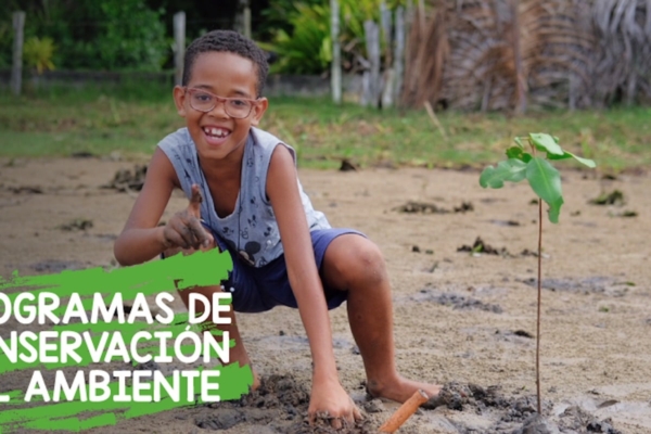 outreach program slogan with a kid with a plant behind as a background