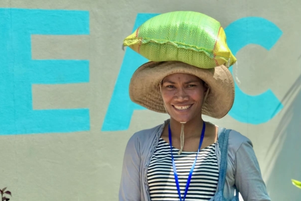 Lady with bag or rice on her head