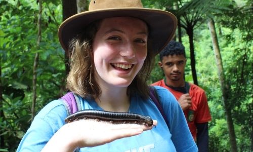 girl with millipede on her hand