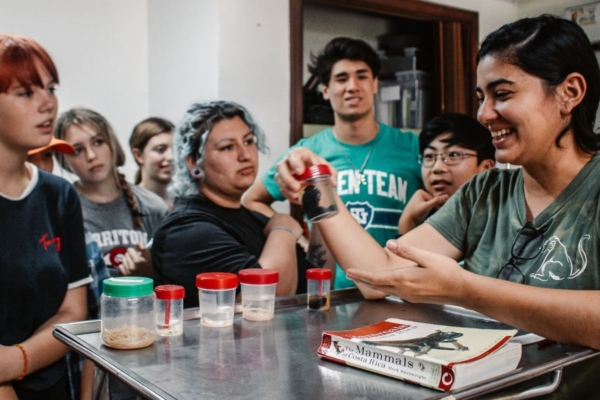 Group of students examining samples