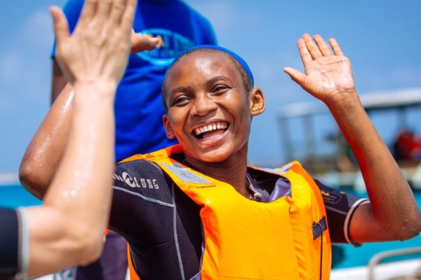 Smiling boy giving high five