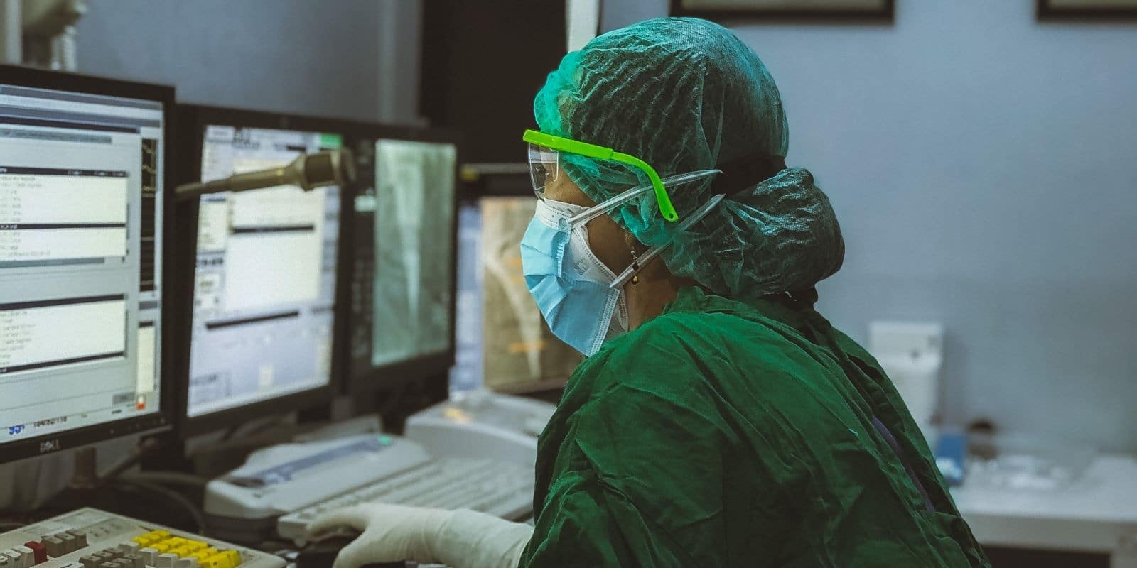 a medical intern reading in a computer