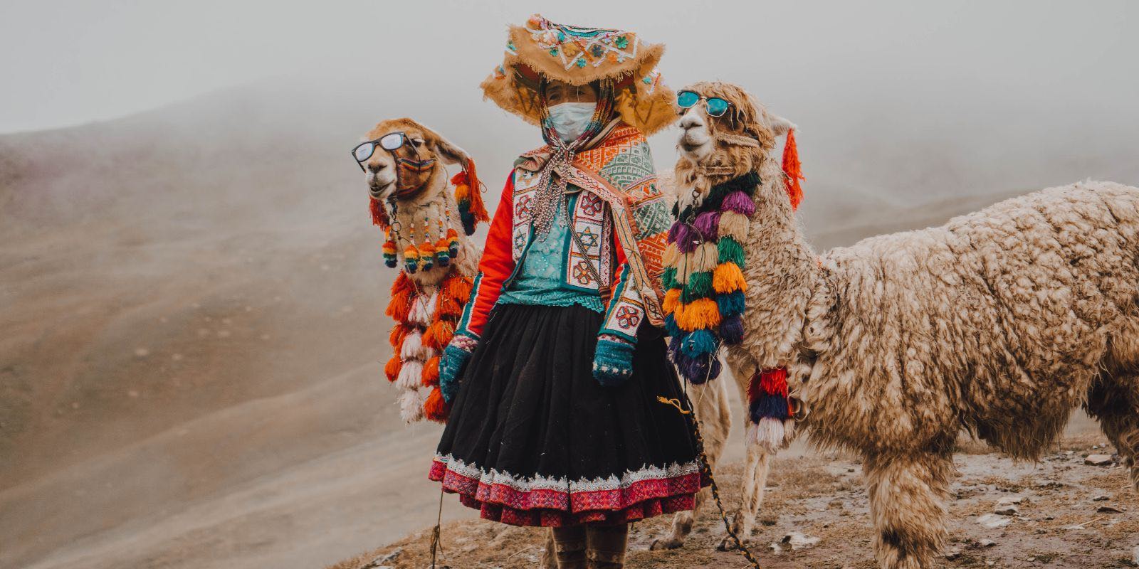 woman standing on a hill with traditional Peruvian clothing
