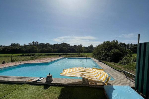 A pool under a bright sunny day.