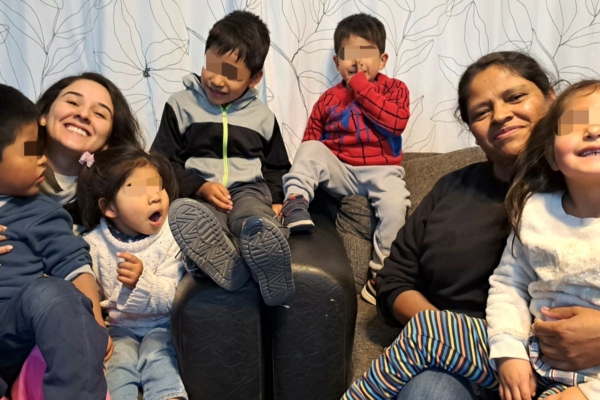 A group of children sitting on a couch