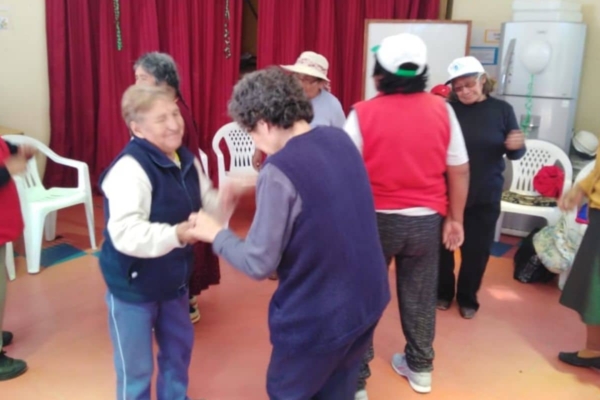 A group of people dancing in a room