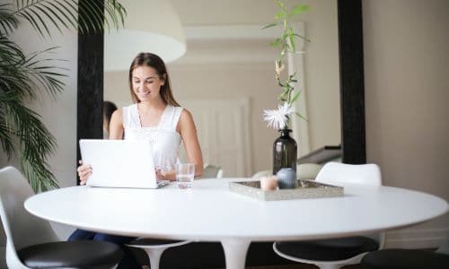 a woman working remotely on her laptop