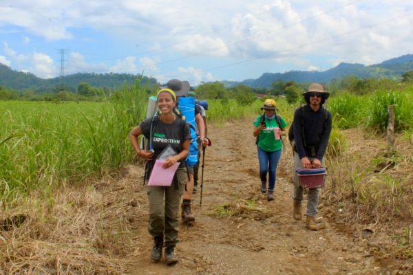 People hiking through the fields