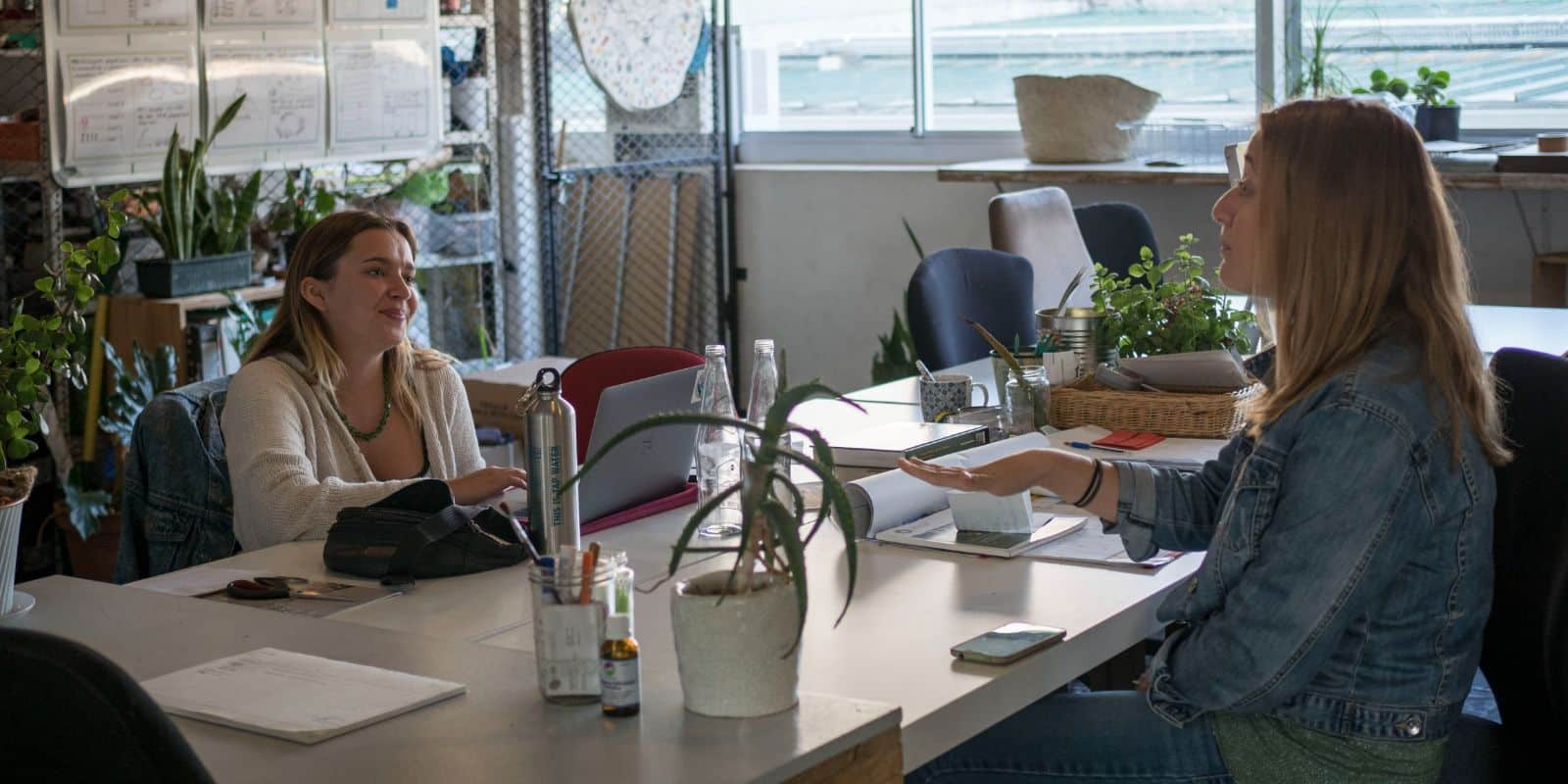 Sustainability-focused volunteers working on a project in an office space
