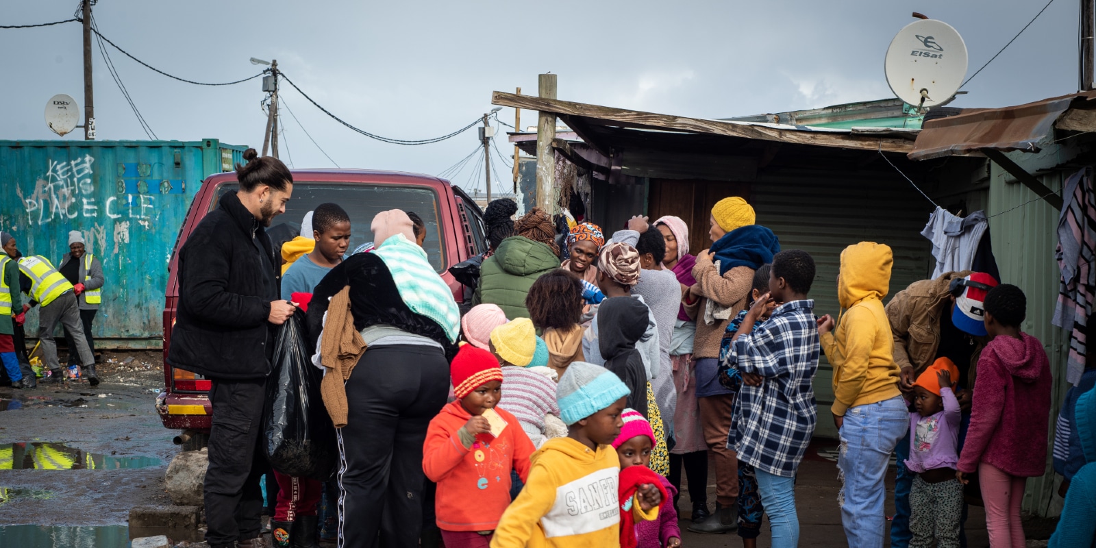 Interns handing out food to children in Cape Town