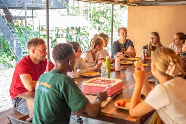public health interns in livingstone, zambia eating a meal together