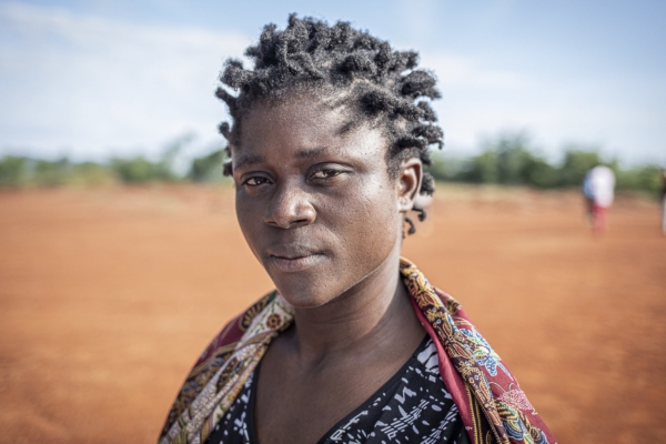 A close-up portrait of a woman in Malawi, capturing her thoughtful expression during an agroforestry internship focused on community and environmental impact.