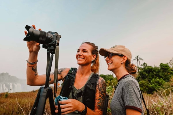 Two photography interns trying to capture a shot.
