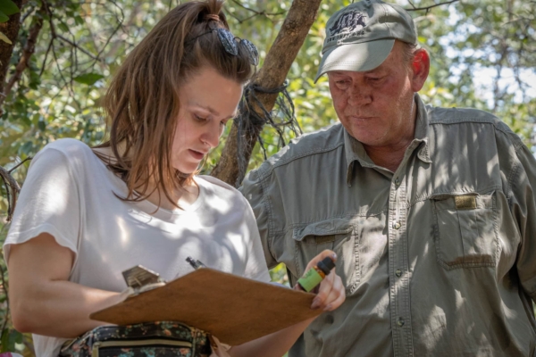 Two photography interns discussing and mapping what to do next.