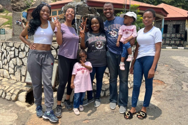 Group of people casual-wear with kids posing for a picture.