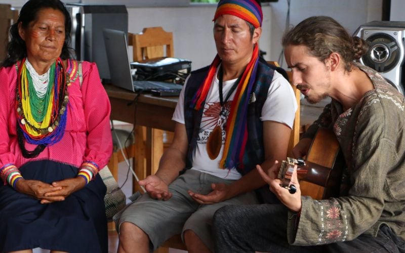 Intenr and locals singing and praying.