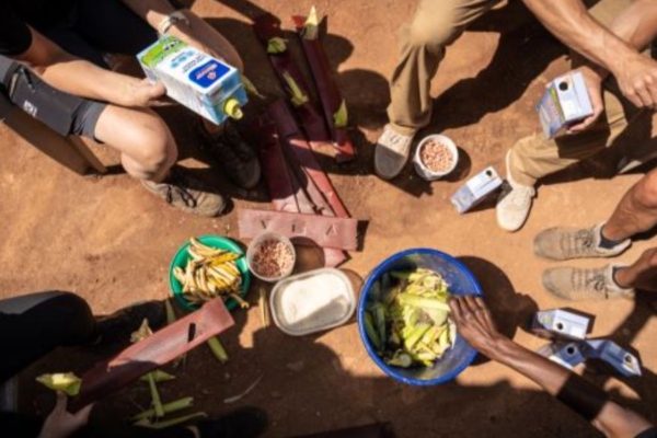 Volunteers preparing enrichment food for animals in wildlife sanctuary