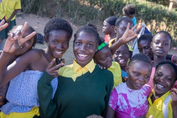 Smiling kids in Zambia because of the Social Work internship.