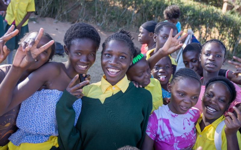Smiling kids in Zambia because of the Social Work internship.