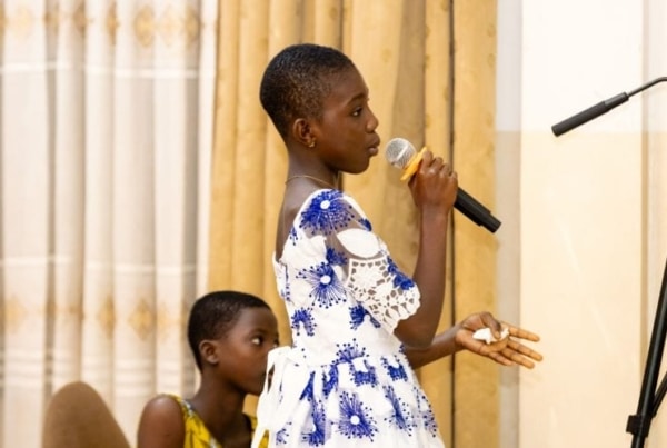 Young girl speaking in a seminar.