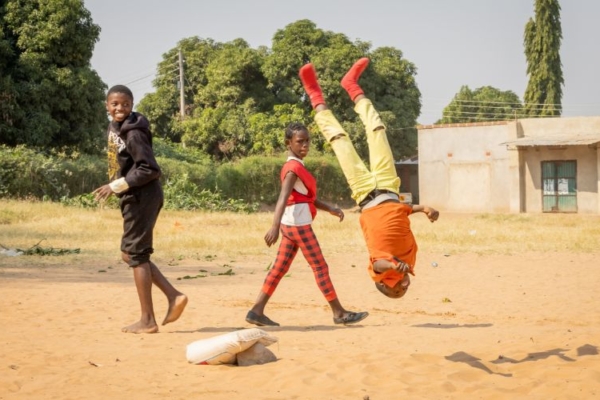 A kid doing a backflip in Zambia.