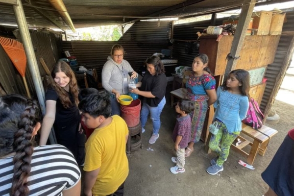 Interns helping out a family.