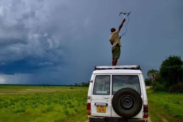 Intern in Lilongwe on top of a truck trying to get a signal.