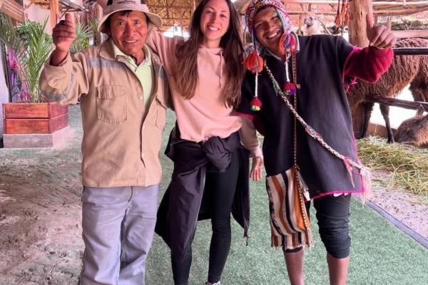 An intern posing with the locals in Latin America during her Social .Business internship