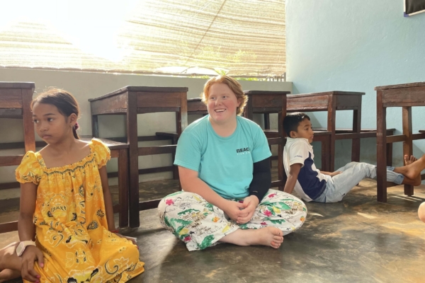 An intern hanging out with the kids in Cambodia during her public health internship.