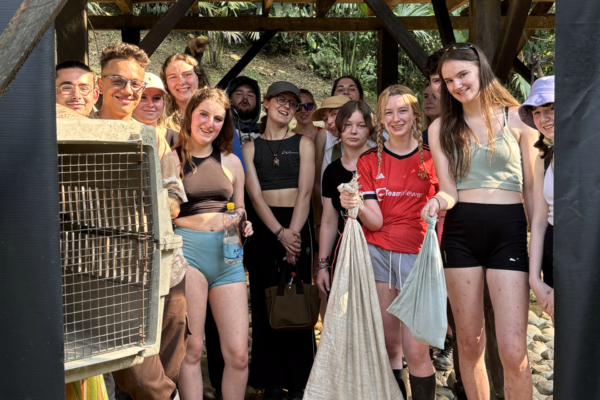 A group of interns for the animal wildlife rehabilitation in Ecuador posing for a group photo.