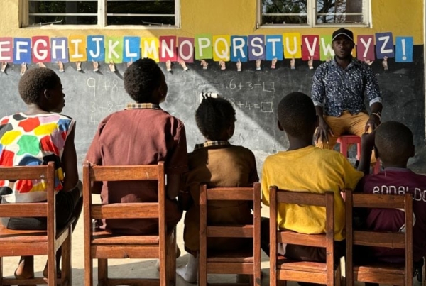 An instructor teaching the students in Zambia.