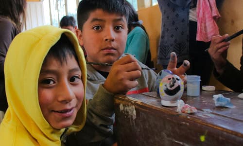 Kids painting easter eggs
