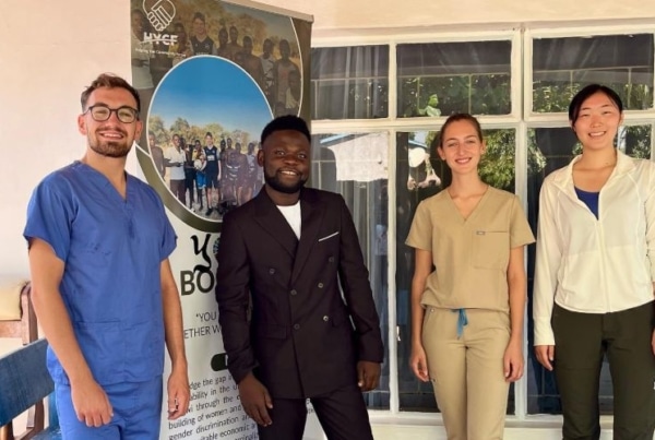 Medical interns in Malawi posing for a picture along with David the CEO.