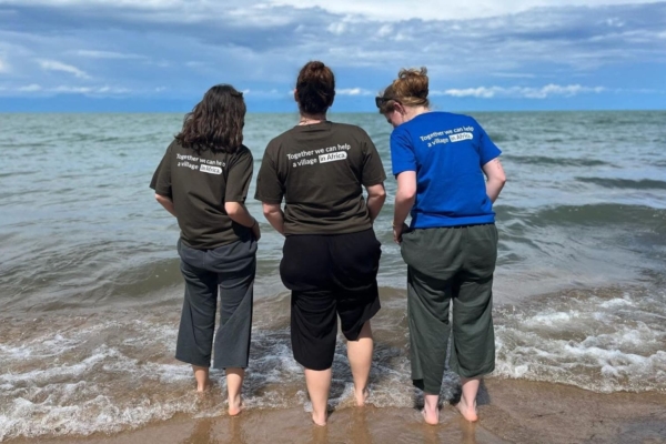 Three medical interns getting their feet wet at the beach in Malawi.