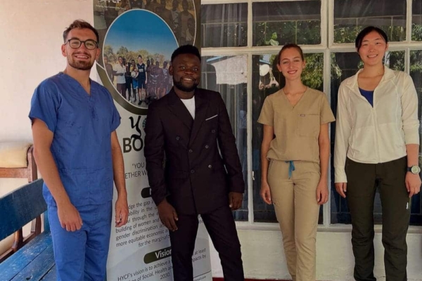Medical interns in Malawi posing for a picture along with David the CEO.