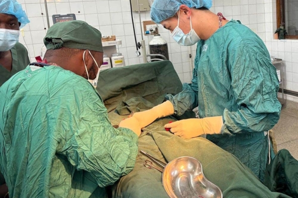 Medical Interns assisting in a clinical operation.