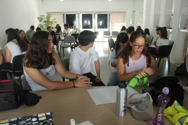 A class of interns grouped up during an activity.