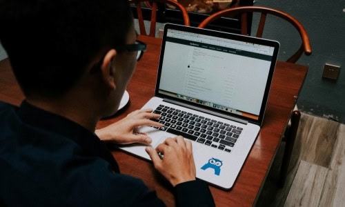 remote intern on a tech innovation & AI internship sitting at a laptop and typing