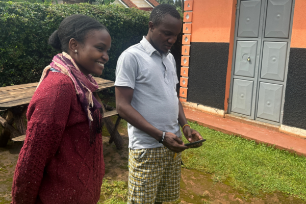 Two people standing outside.
