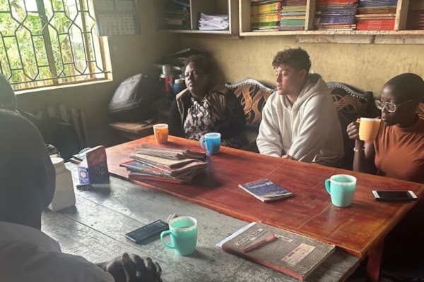 A group of people sitting around a table.