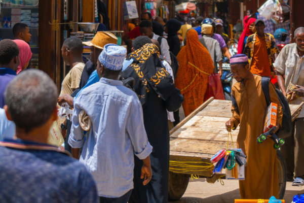A street crowded with people in Tanzania.