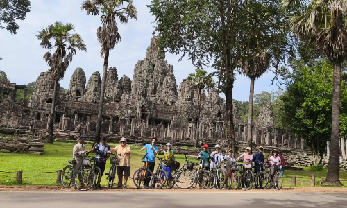 group of tourists with bike in Cambodia