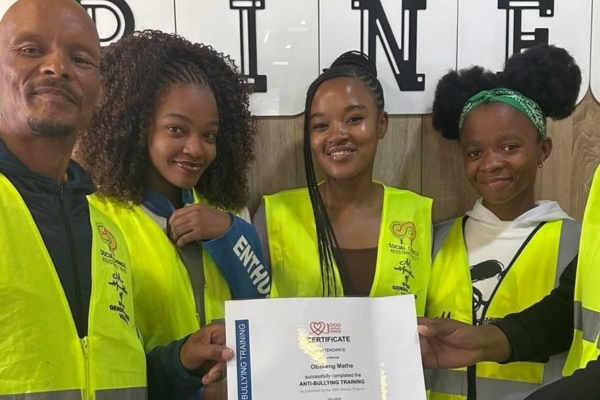 Group showing their certificate of a training course